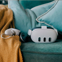 Meta Quest and controllers left on sofa